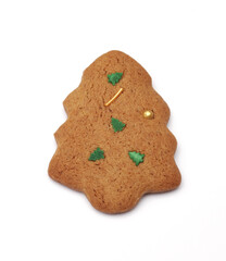 Homemade cookies in the shape of a Christmas tree on a white background. Close-up