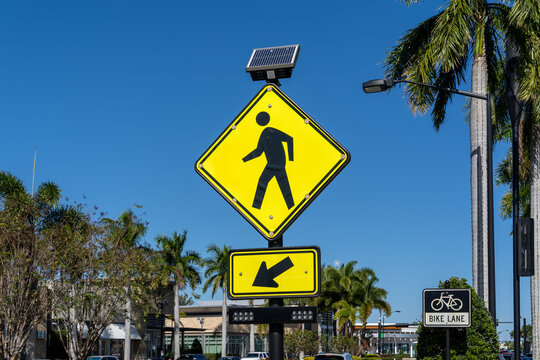 Sarasota, Florida, USA - January 11, 2022: A Pedestrian Crossing Sign is shown. 
