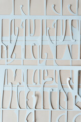 abstract background with machine cut paper shapes on blank paper
