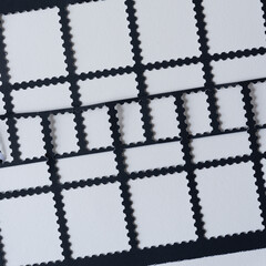 abstract pattern composed of black paper stencils with fancy rectangle borders on blank paper