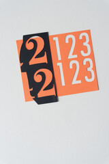 numbers 2 or 22 and 1, 2, and 3 on blank paper