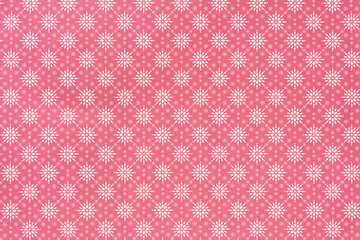 holiday themed scrapbook paper background: white snowflake pattern on red