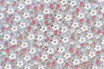 holiday themed scrapbook paper background: poinsettias pattern with gold foil accents
