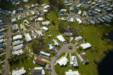 Badly damaged mobile homes after hurricane Ian in Florida residential area. Consequences of natural...