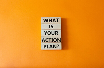 Naklejka premium What is your action plan symbol. Wooden blocks with words What is your action plan. Beautiful orange background. Business and What is your action plan concept. Copy space