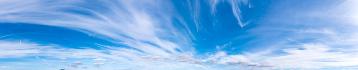 Fototapeta premium Panoramic view of blue sky with fluffy clouds
