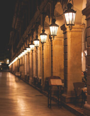 Liston pedestrian street night view with evening lanterns illumination, Kerkyra city, Corfu island, Greece, Ionian sea islands, old town center