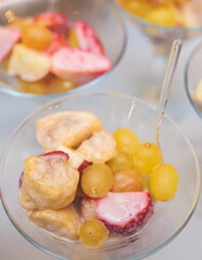 Beautifully decorated catering banquet table with desserts setting, variety of different fruits and berries on corporate Christmas birthday party event or wedding celebration