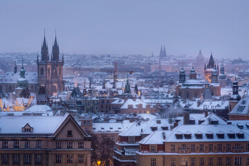 View of Prague roofs, the Tyn temple and the Old town Square in winter during Christmas.	
