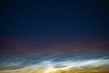 Fototapeta premium Silver clouds in the night sky in Russia.