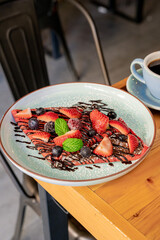 Red velvet crepe with red fruits