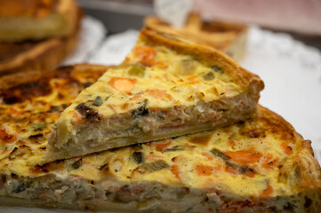 Traditional French quiche vegetable pie with green courgette and carrot
