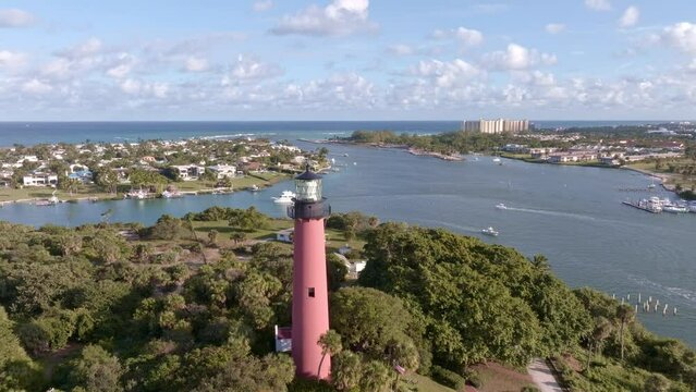 Scenic aerial video of Jupiter inlet lighthouse located on the Florida east coast. USA December 2022