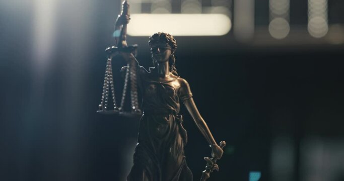 Legal and law concept statue of Lady Justice on blurred background	