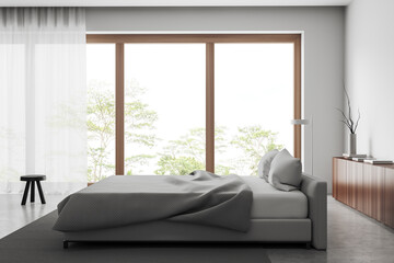 Light bedroom interior with bed and decoration, panoramic window