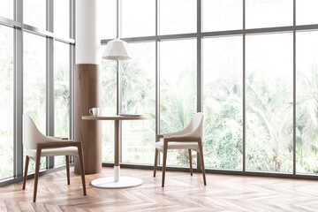Fototapeta premium Bright cafe interior with panoramic windows with countryside view