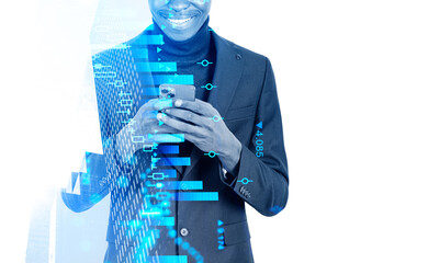 African businessman using smartphone, graph dynamics with candlesticks. Copy space
