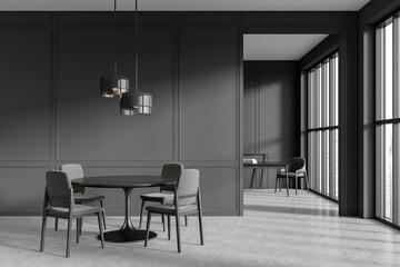 Front view on dark dining room interior with armchairs, table