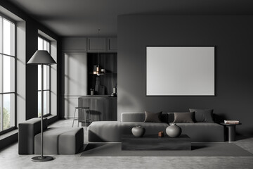 Dark studio interior with sofa, empty white poster, panoramic windows