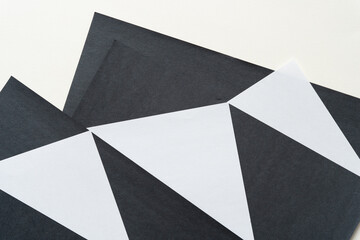black and white paper design with triangle motifs