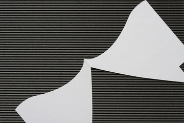 abstract wavy and sharp cutout silhouette on corrugated paper - obrazy, fototapety, plakaty