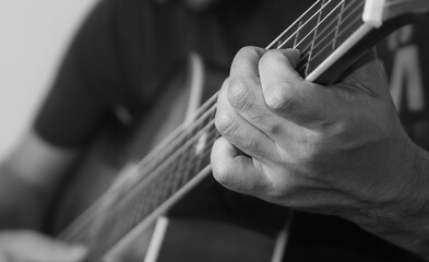 Close up of hands playing guitar