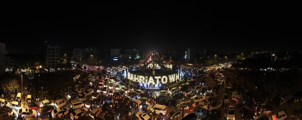 Fototapeta na wymiar A 180 degrees view of a Bahria Town roundabout after the new year's celebration and consequent traffic jam of stuck vehicles. 