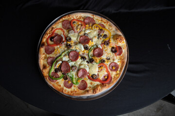 pizza with salami and olives