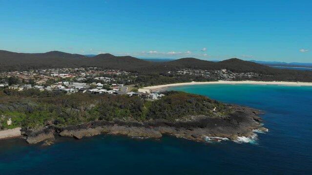 Drone video flying over Barry Park lookout toward Fingal Head on a bright spring day