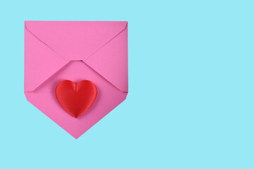 Valentines Day Concept. Red Heart on a pink envelope, with teal background and copy space.