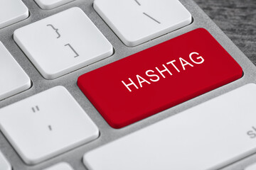 Fototapeta premium Red button with word HASHTAG on computer keyboard, closeup