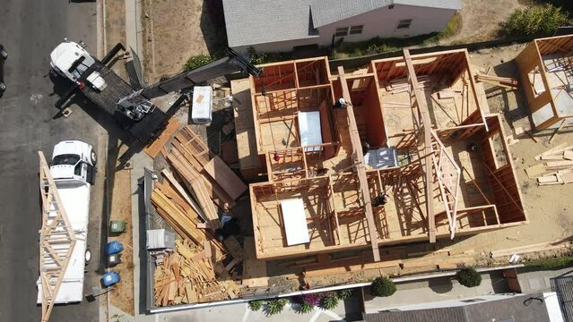 New house construction framing with crane