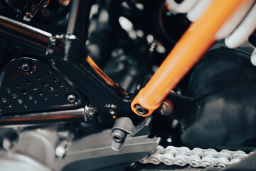 Shock absorber, powerful motorbike engine safe driving concept vintage black orange color