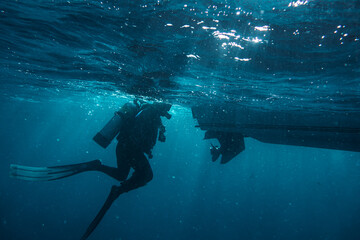 diver getting on the boat