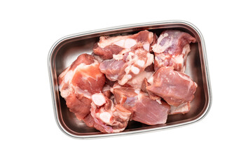 Isolated fresh soft-bone pork or soft spare rib, fresh soft spare rib in a stainless container on white background, cut small pieces of soft fresh spare ribs.