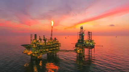 Areal photography from top view of jack up rig scenery with blue ocean view.