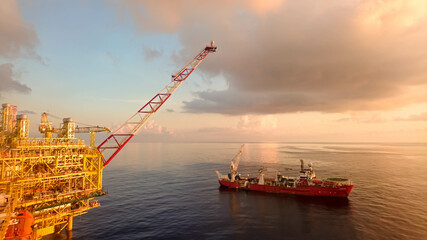 Areal photography from top view of jack up rig scenery with blue ocean view.