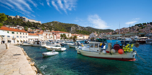 Fototapeta na wymiar Hvar harbour, Croatia with fishing boats on sunny day