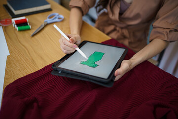 Tailor woman working in tailor shop Stylish Fashion designer tailor in workshop studio designing new collection Dressmaking and Creative.fashion collection.