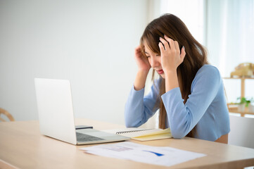 Office syndrome. Overworked tired young asian woman feeling headache, having eyesight problem after computer laptop work. Stressed young woman suffering from fatigue at home