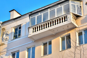 The top floor of an old multi-storey residential building on a winter day