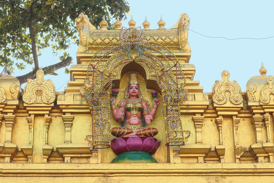 Goddess Lakshmi or Padmavati on the roof of a temple in Tirupati, India.