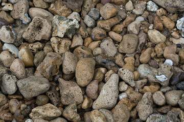 Smooth round pebbles on the beach in Bangkalan, Madura, Indonesia.