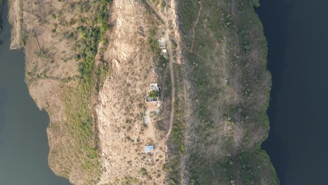 Bahubali Hills, Udaipur, Rajasthan, India 28th December 2022: Popular prewedding destination and trekking spot near Udaipur. 4k Aerial view of Bahubali hill and Badi lake near Barda village