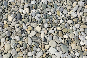 Stones, sea pebbles as a background, texture.