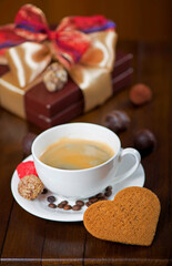 Coffee and cake. a cup of coffee and candy on vintage wooden background