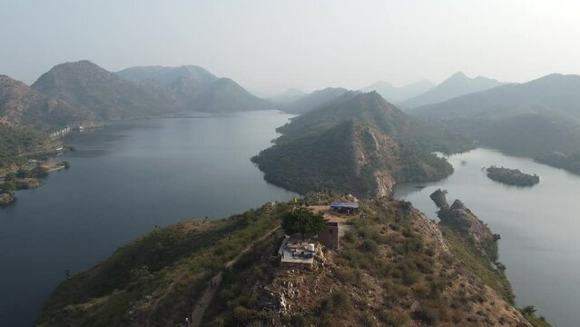 Bahubali Hills, Udaipur, Rajasthan, India 28th December 2022: Popular prewedding destination and trekking spot near Udaipur. 4k Aerial view of Bahubali hill and Badi lake near Barda village