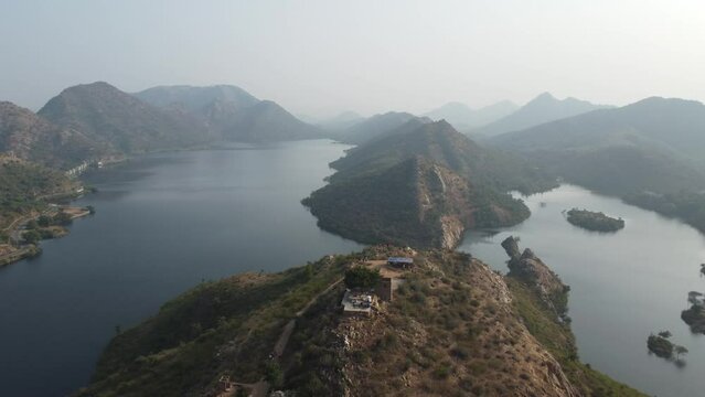 Bahubali Hills, Udaipur, Rajasthan, India 28th December 2022: Popular prewedding destination and trekking spot near Udaipur. 4k Aerial view of Bahubali hill and Badi lake near Barda village