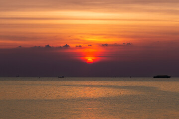 Fototapeta na wymiar The sun sets at Bang Pu Recreation Center on New Year's Eve (Gulf of Thailand)