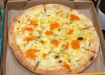 Pizza in a cardboard box